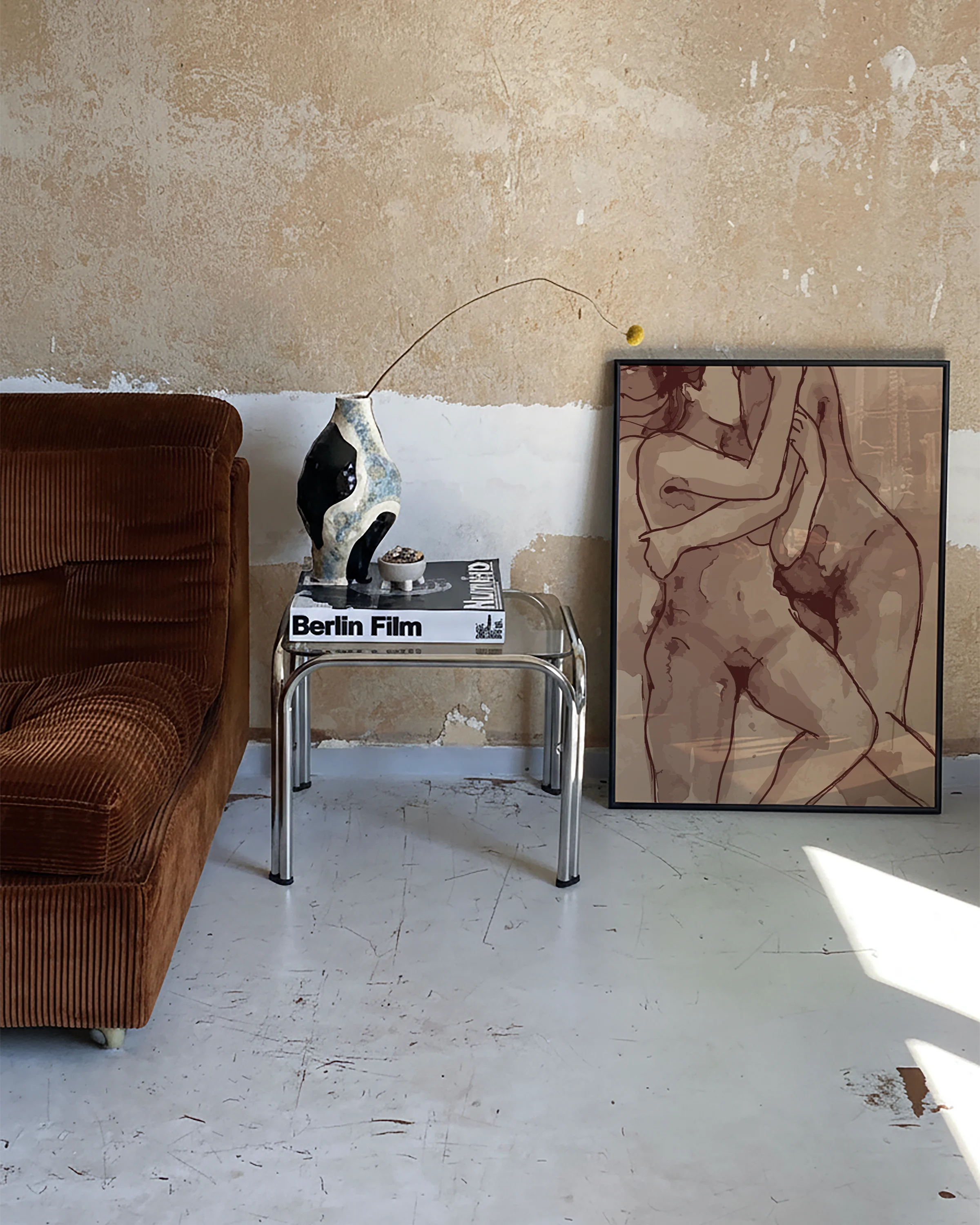 A poster of two naked women laying down and hugging.