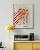 A poster with a woman, repeated three times, looking through a pair of binoculars with the text ‘WHERE THEM GIRLS AT?’.