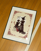 A poster with a lesbian witch couple.
