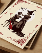 A poster with a lesbian witch couple.