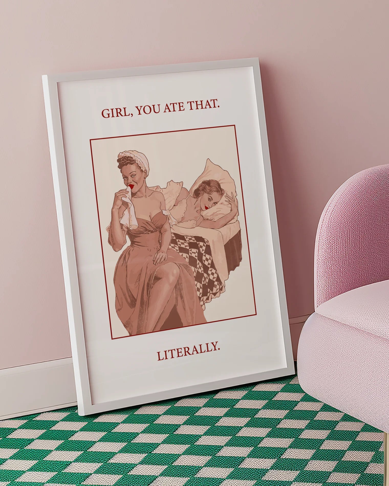 A poster featuring a woman wiping her mouth with a cloth napkin while sitting on the edge of a bed, with another woman lying behind her. Text on the artwork reads: “GIRL, YOU ATE THAT. LITERALLY.”