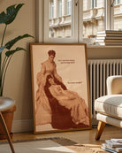 A framed poster featuring two sapphic women from the Victorian era in a conversation: 'Am I the first woman you've slept with?' 'You mean tonight?'.