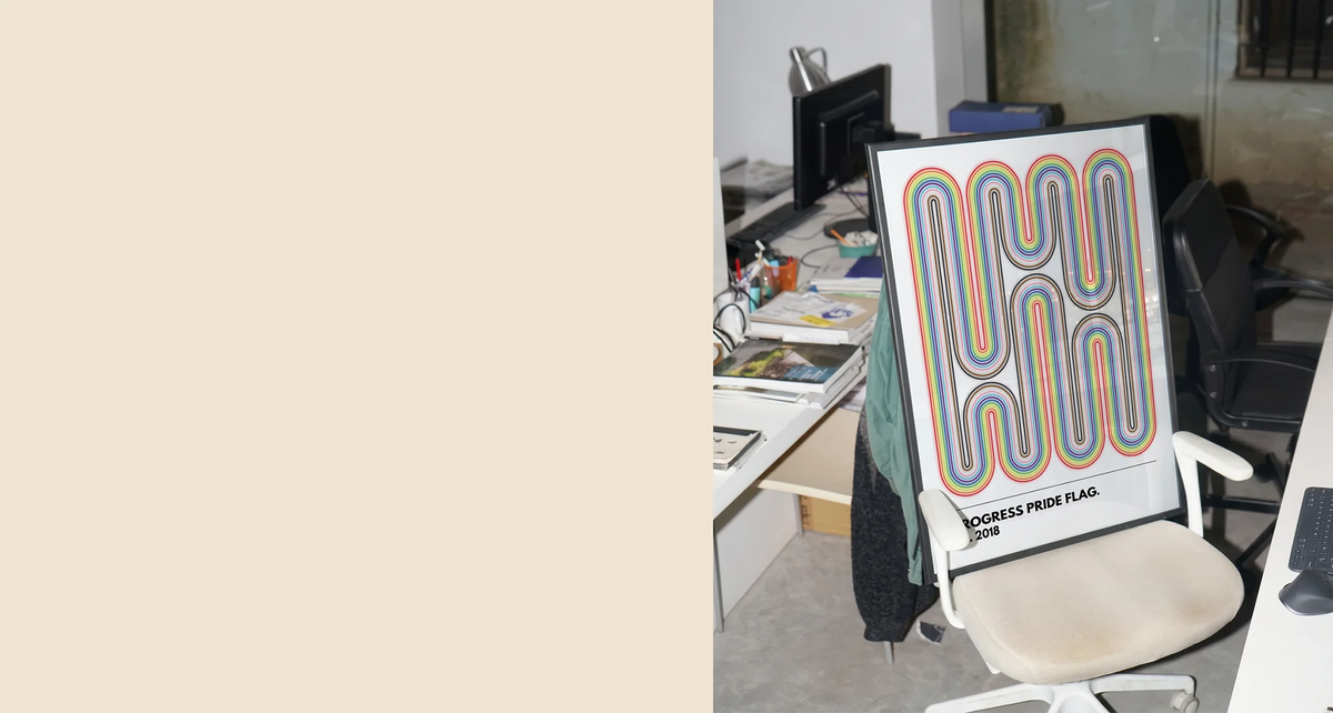 A gay pride poster in an office space.