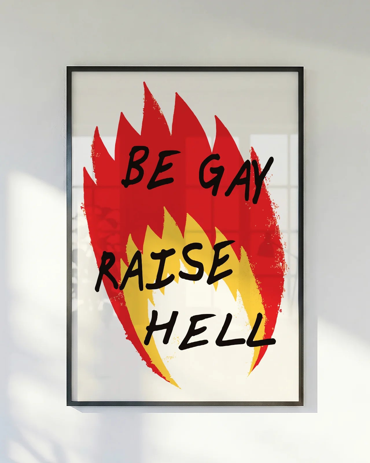 A poster with an illustrated flame, with the text 'BE GAY RAISE HELL'.