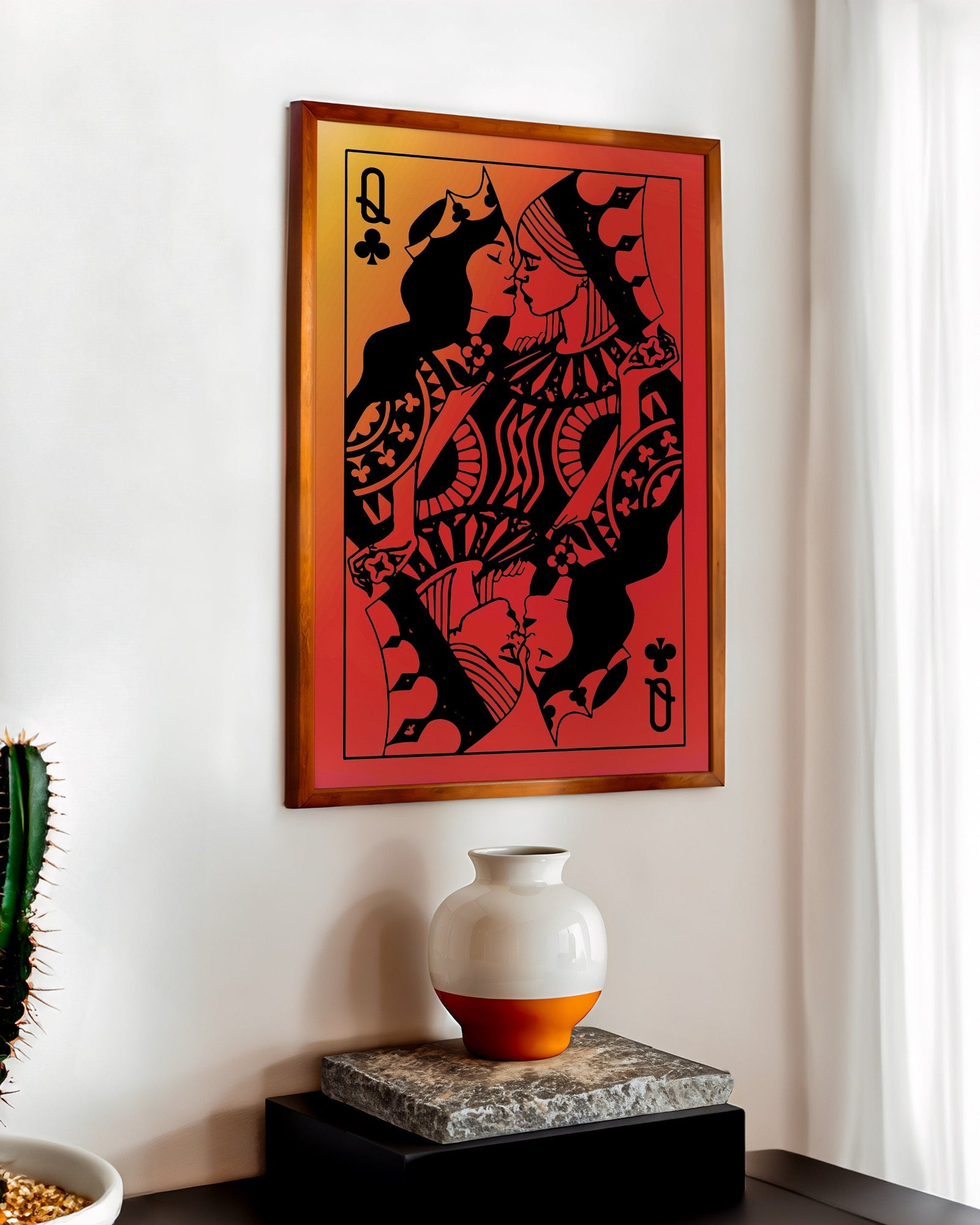 A poster with a sapphic couple kissing, card deck style. Two queens. Red background.
