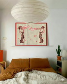 A framed poster with two gay cowboys.