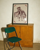 A poster with two gay cowboys riding on a horse together.