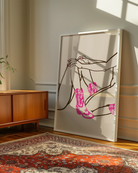 A poster with two naked cowgirls in pink boots.