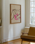 A poster with two naked cowgirls in pink boots.