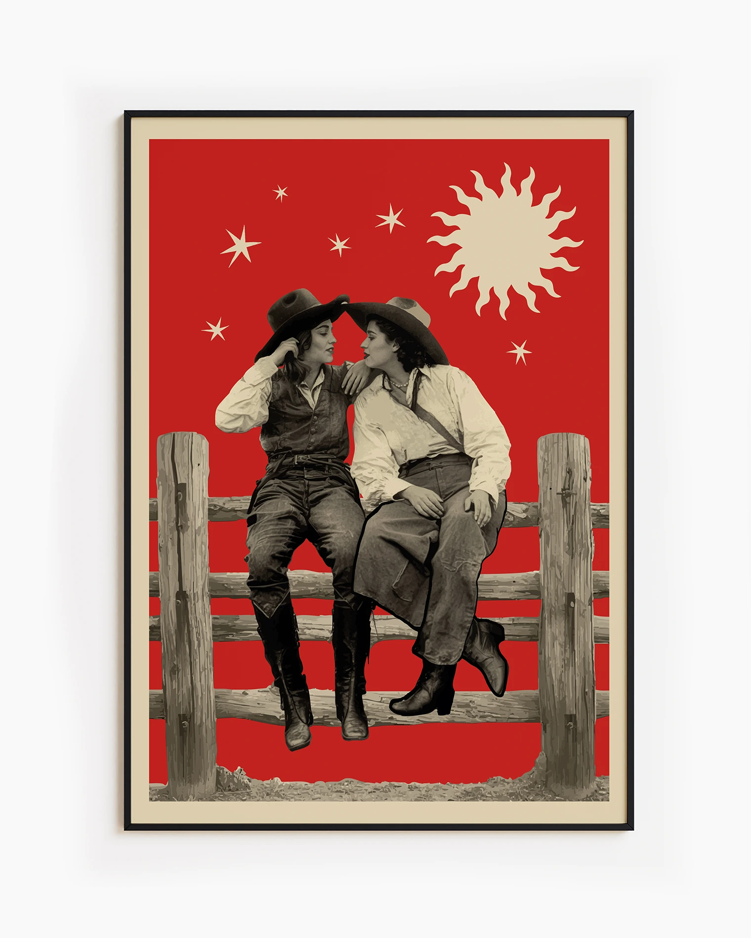 A framed poster with two lesbian cowgirls, sitting on a wooden fence, talking and flirting.