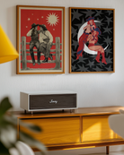 A framed poster with two lesbian cowgirls, sitting on a wooden fence, talking and flirting.