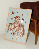 A poster with two lesbian cowgirls riding on a horse together.