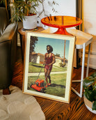 A poster featuring a fabulous drag queen in a red, glittery dress, big wig, and full makeup, mowing the lawn. The background is a charming suburban neighborhood from the 1970s, with a warm, nostalgic retro vibe.