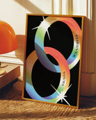 A print with two illustrated, shiny engagement rings in smooth pride colours with the engraved text 'Forever yours'.