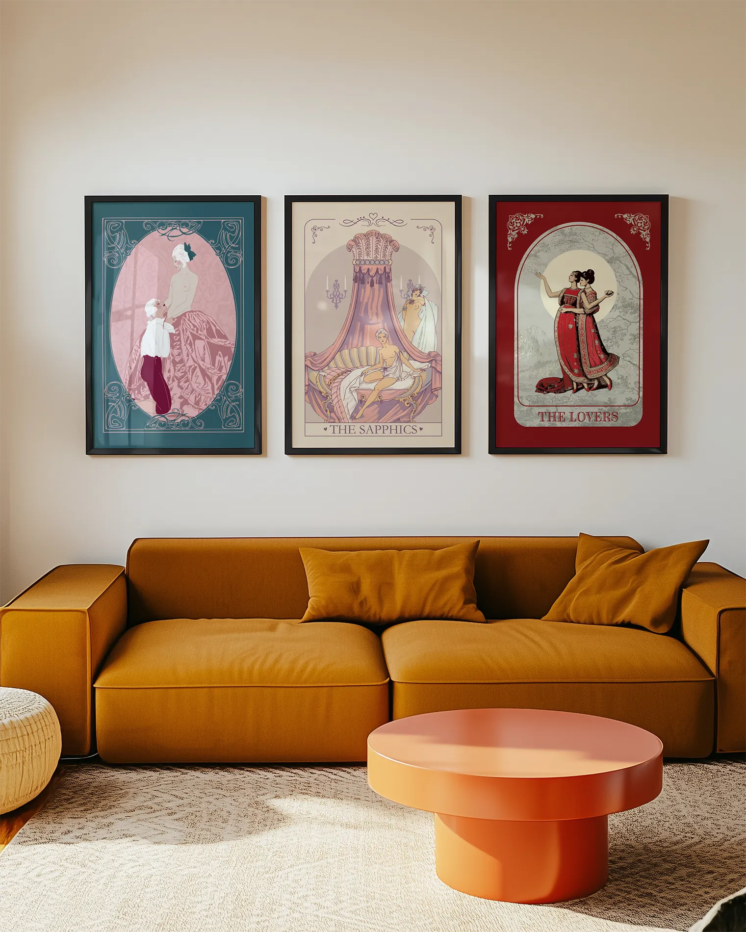 A gallery wall with three sapphic themed prints.