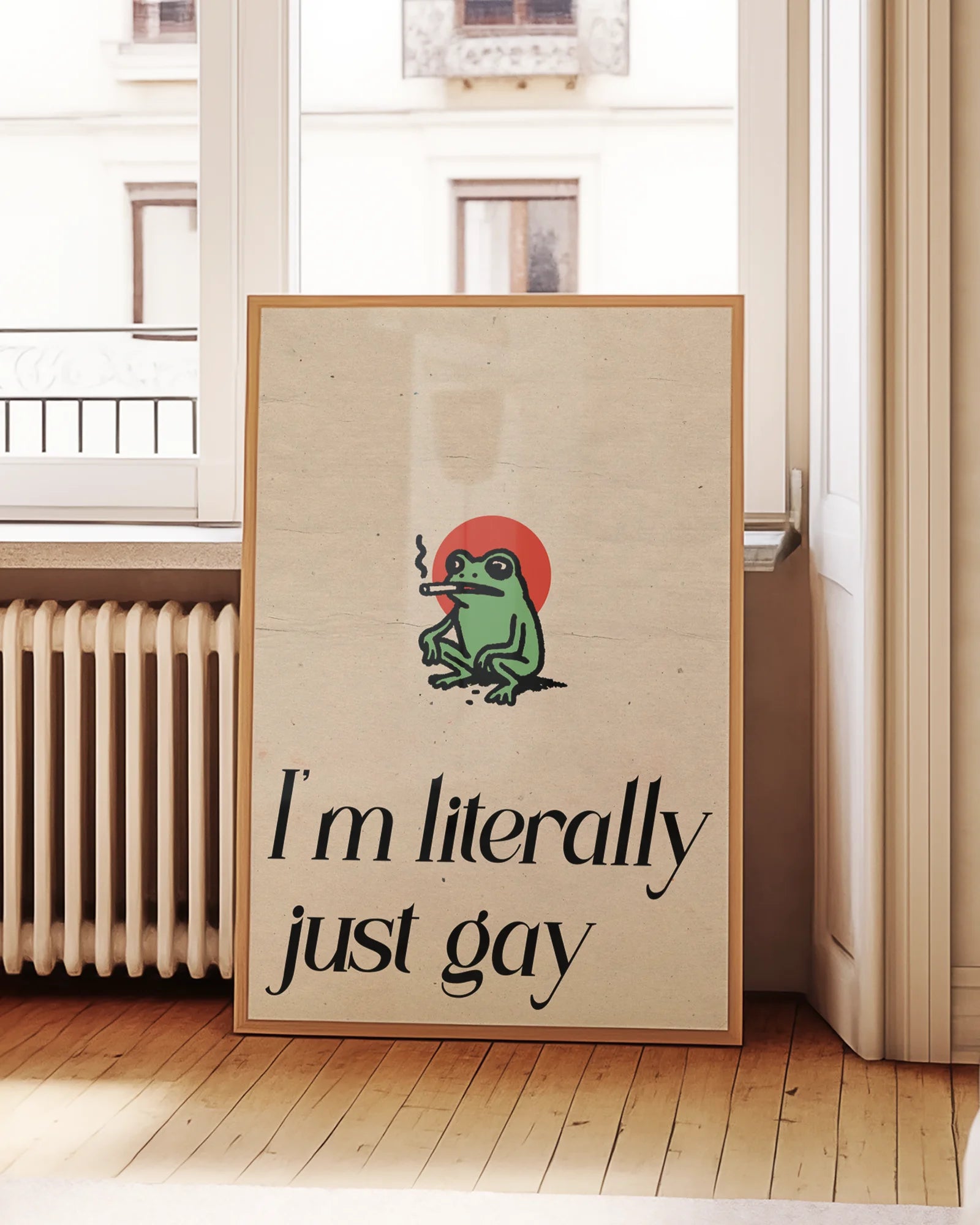 A framed poster with a cute, green, smoking frog with the text 'I´m literally just gay'.