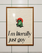 A framed poster with a cute, green, smoking frog with the text 'I´m literally just gay'.