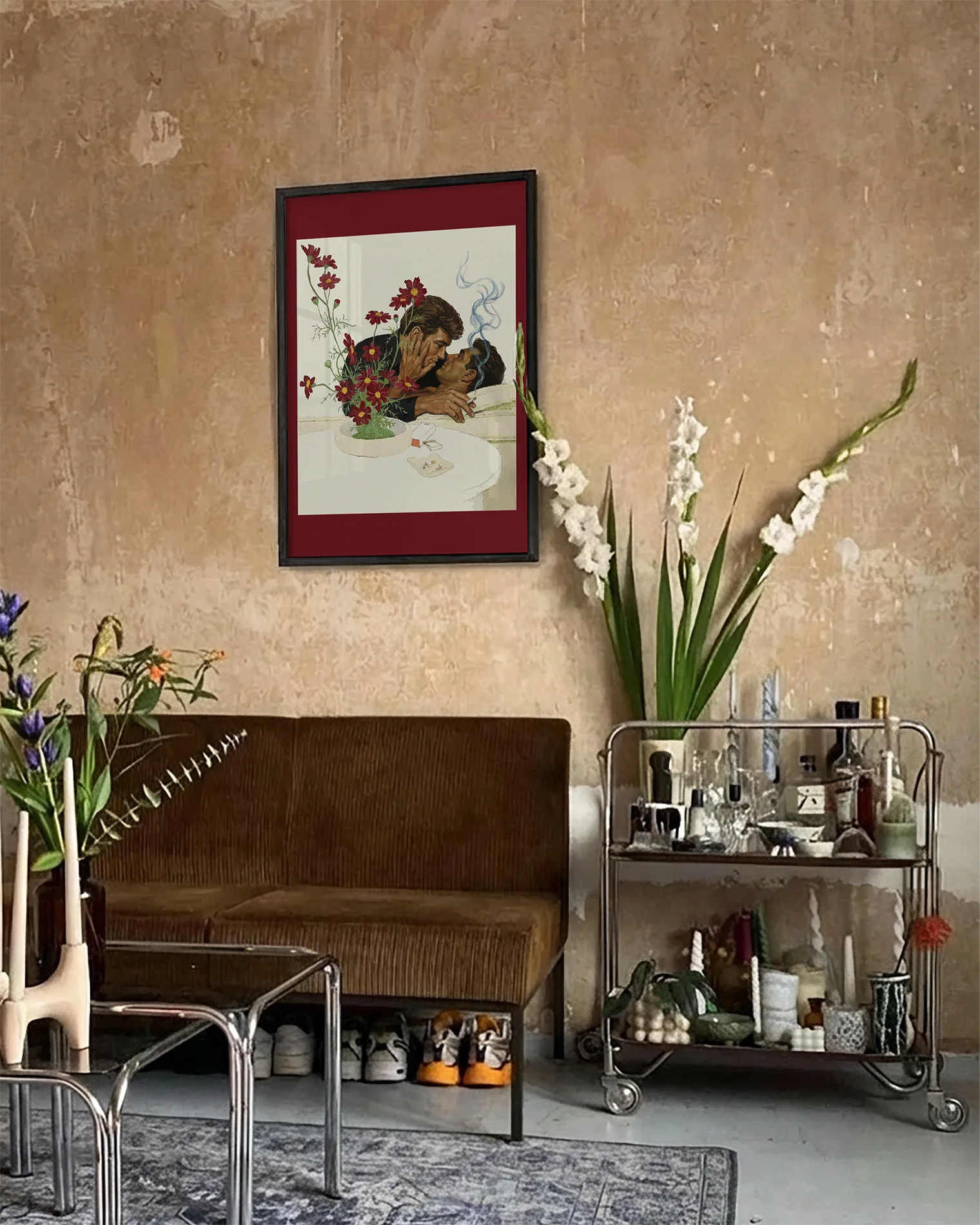 A framed print with two gentlemen in suits kissing on a couch, 1940's vintage style.