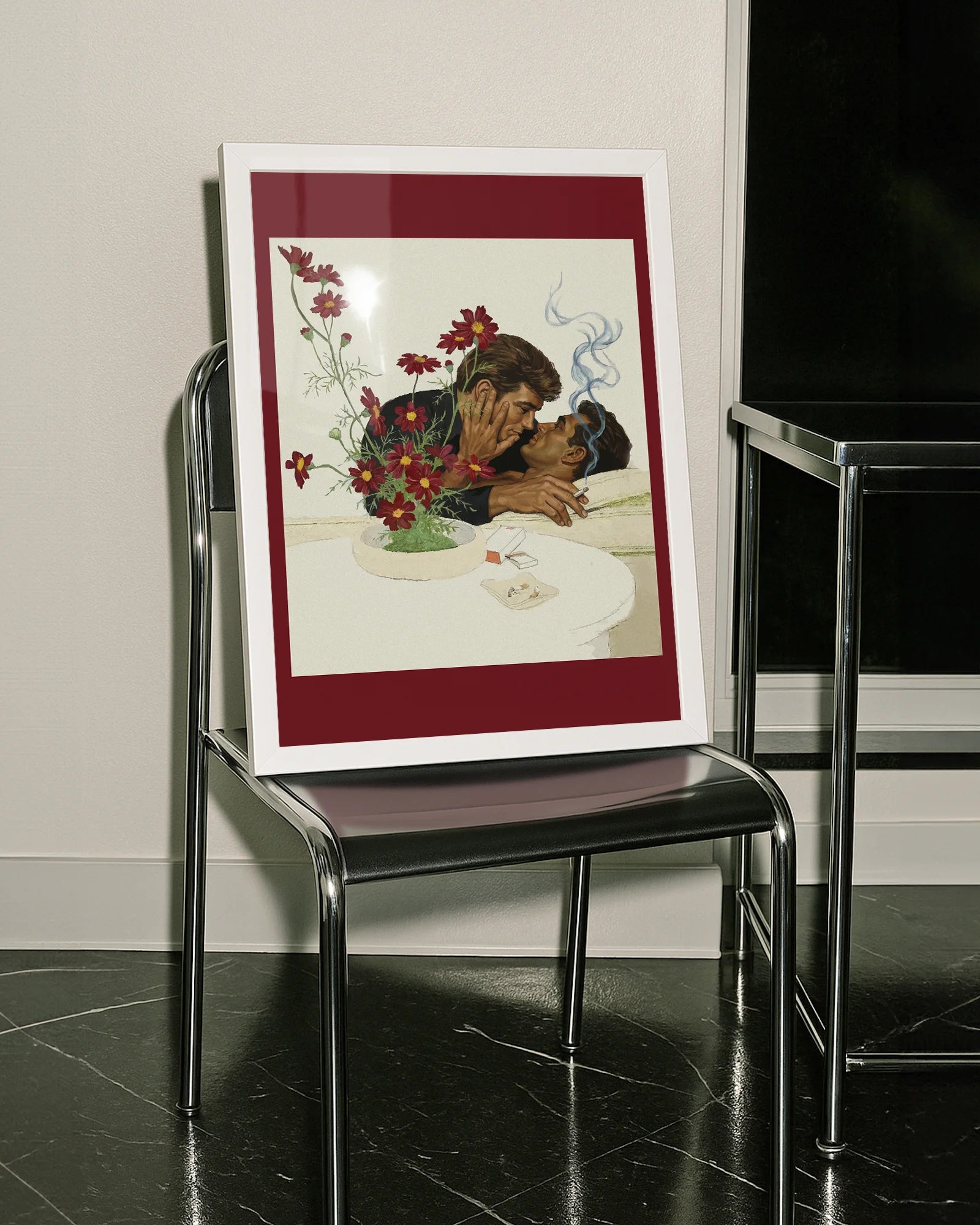 A framed print with two gentlemen in suits kissing on a couch, 1940's vintage style.