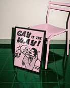A poster with two gay men kissing with the text 'GAY IS THE WAY!'