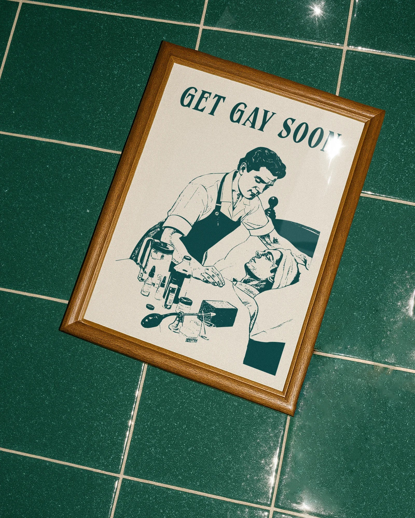 A poster depicting a male nurse taking care of a sick, bedridden man, accompanied by the ironic text: “GET GAY SOON.”