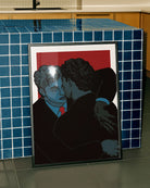A framed poster with two groomsmen hugging.