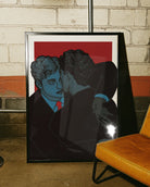A framed poster with two groomsmen hugging.