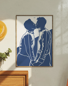 A poster with a silhouette of two men kissing.