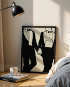 A print with an illustrated male couple in suits, hand in hand.