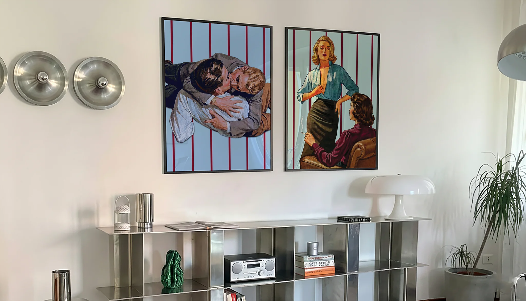 A photo with two framed, queer posters in a livingroom.