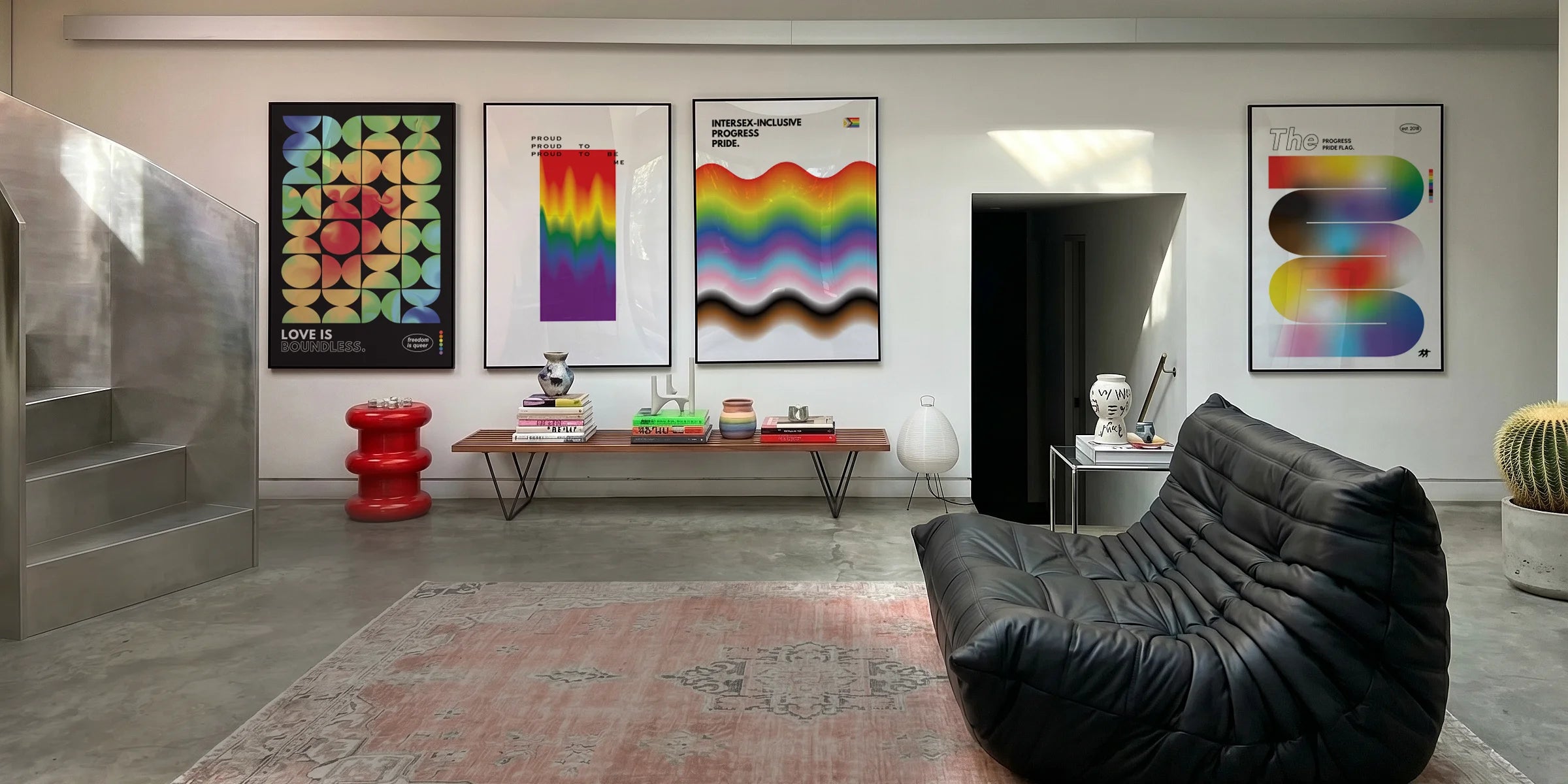 Four pride posters in a room.