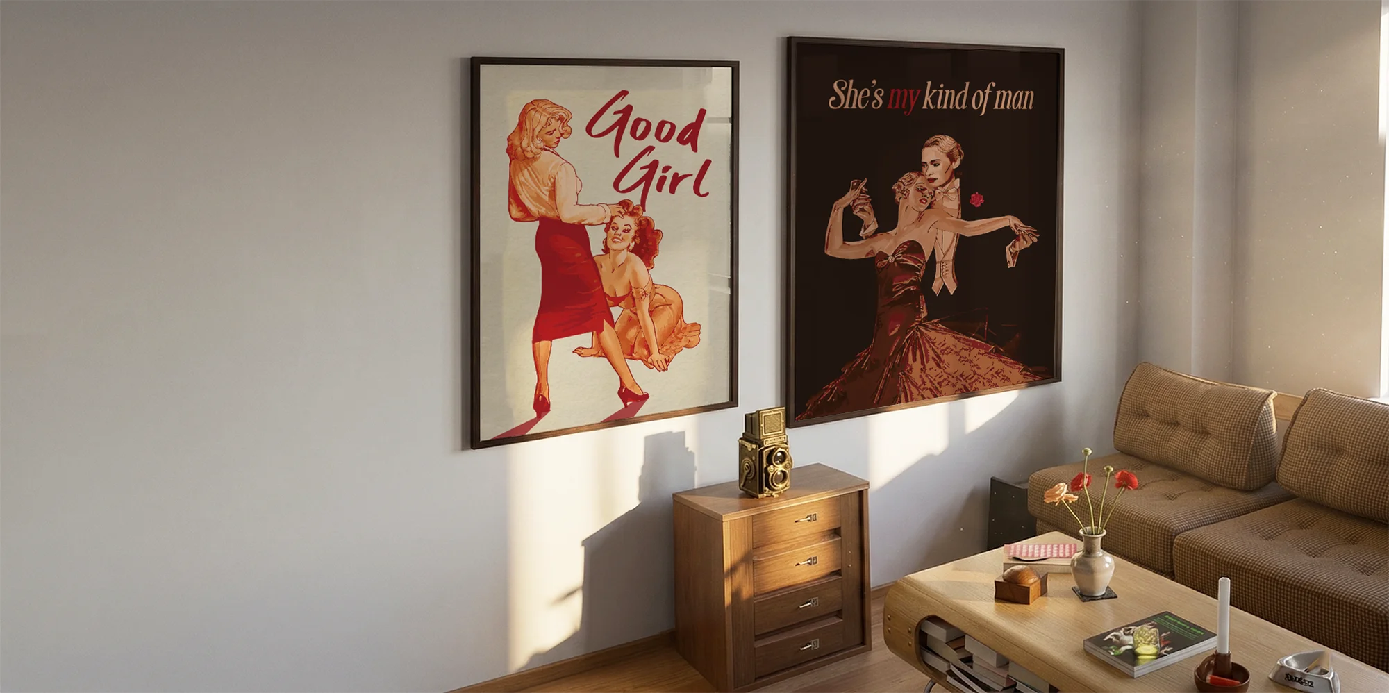 Two framed, queer vintage posters on a wall.