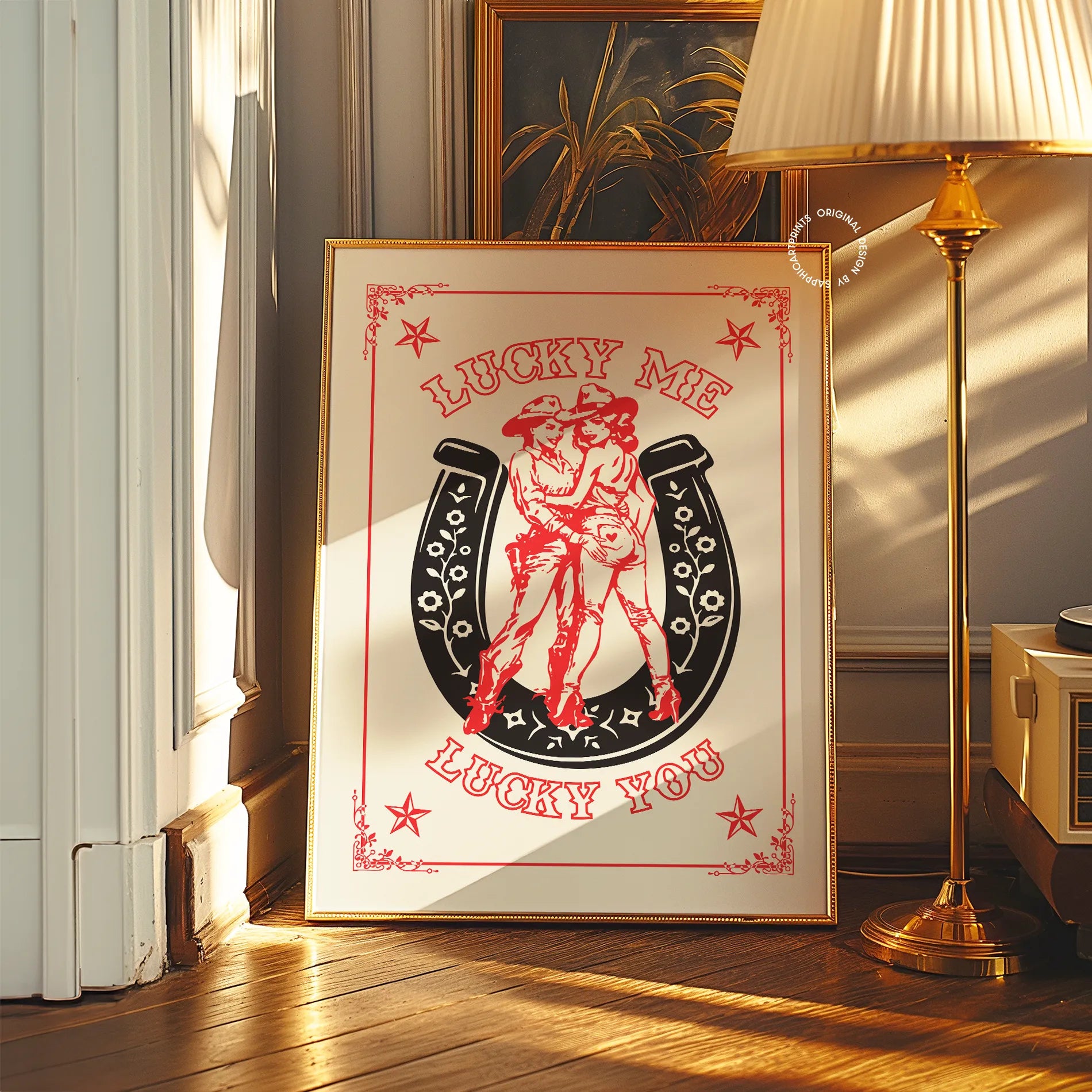 A print with an illustrated, lesbian cowgirls couple with the text 'Lucky me Lucky you.'