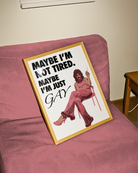 The poster features a fabulous person in pink clothing, heels and a 70s hairstyle with the text 'MAYBE I'M NOT TIRED. MAYBE I'M JUST GAY.'