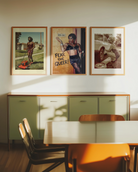A framed poster with a black drag queen standing in front of a wall with a sign 'MEN ONLY', smiling.