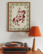 A framed poster with two, naked cowgirls riding a horse.