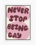 A poster with the text 'NEVER STOP BEING GAY'.