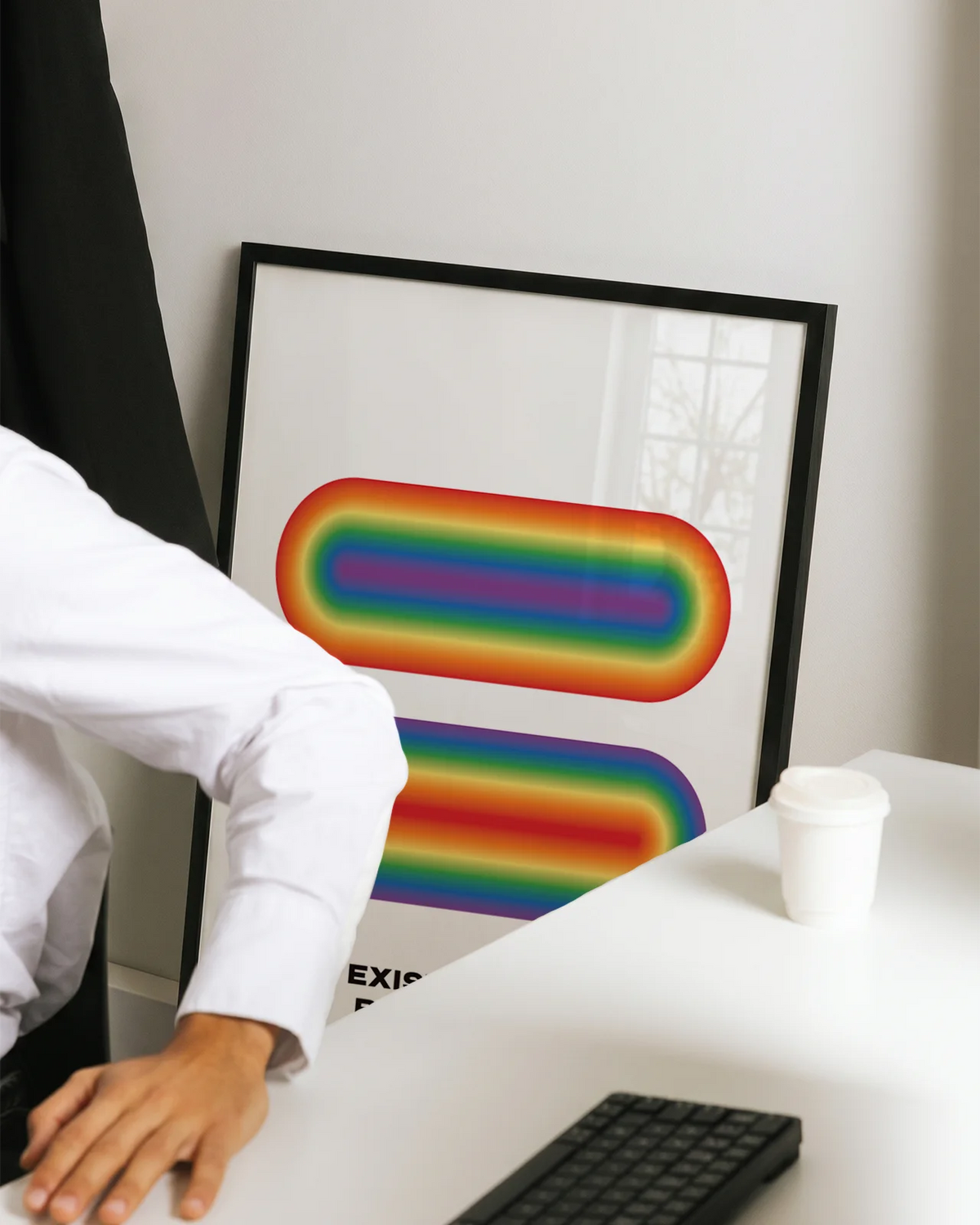 A gay pride poster in an office space.