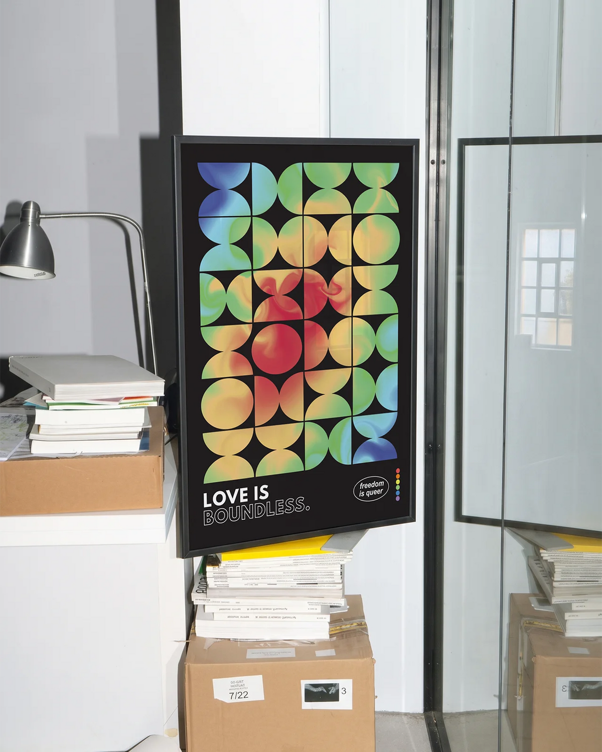 A gay pride poster in an office space.