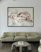 A framed poster with two lesbian girls laying down.