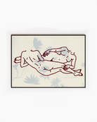 A framed poster with two lesbian girls laying down.