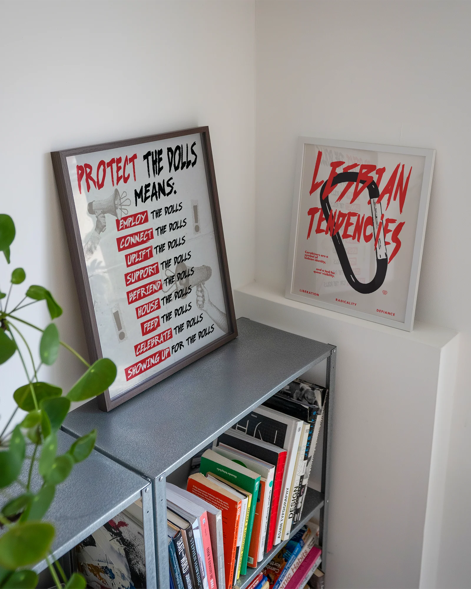 A framed print featuring the text “PROTECT THE DOLLS MEANS:” followed by:
employ the dolls
connect the dolls
uplift the dolls
support the dolls
befriend the dolls
house the dolls
feed the dolls
celebrate the dolls
showing up for the dolls