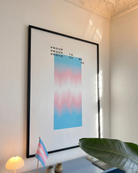 A poster with a gradient transgender pride flag and the text: 'Proud to be me'.