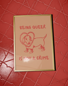 A poster with an illustrated dog, with the text 'BEING QUEER IS NOT A CRIME".