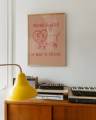 A poster with an illustrated dog, with the text 'BEING QUEER IS NOT A CRIME".