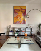 A framed poster with a lesbian, abstract couple.