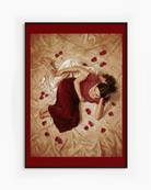 A framed poster with two sapphic ladies in a bed, surrounded by rose pedals.