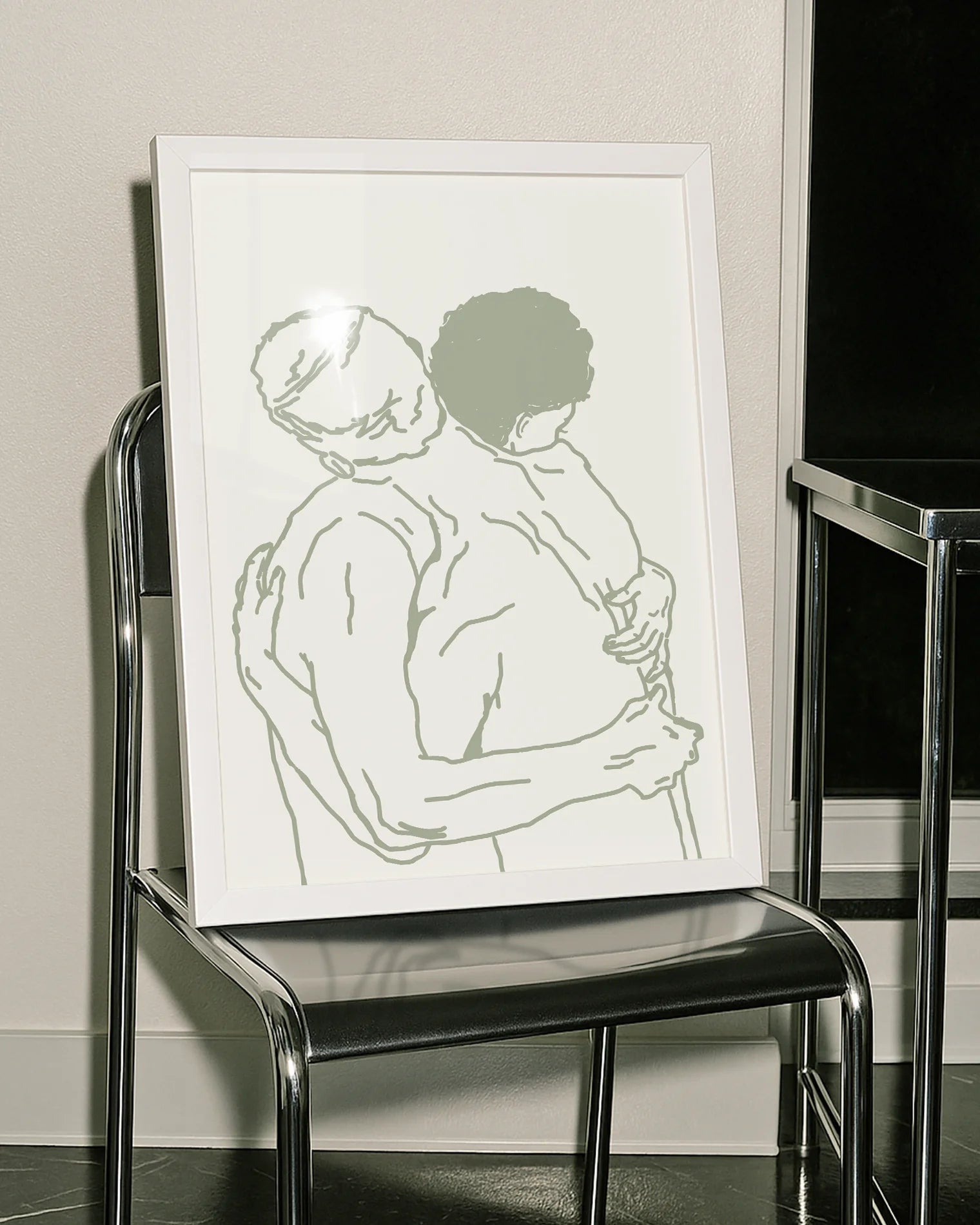 A framed poster with two naked men hugging, lineart style.
