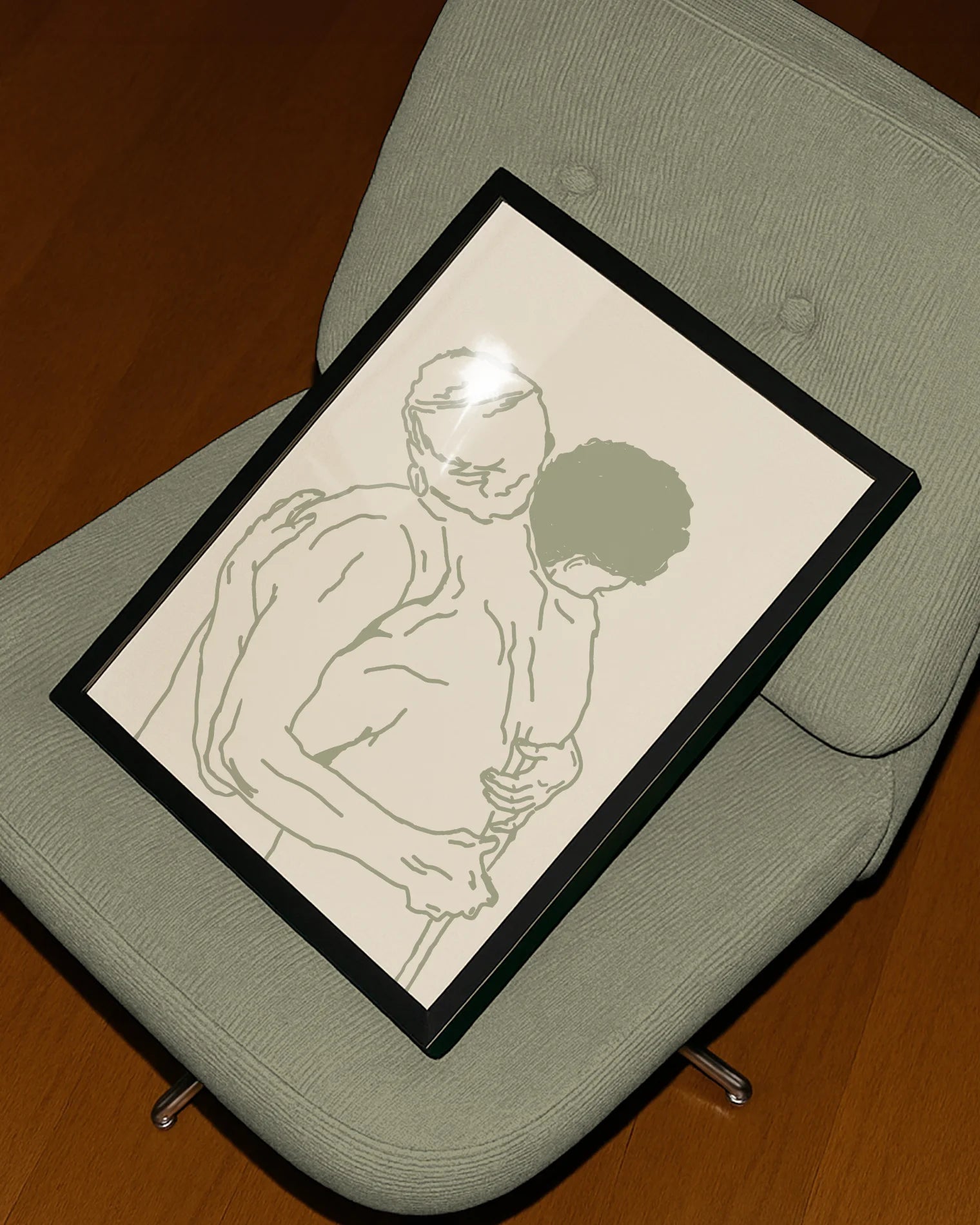 A framed poster with two naked men hugging, lineart style.