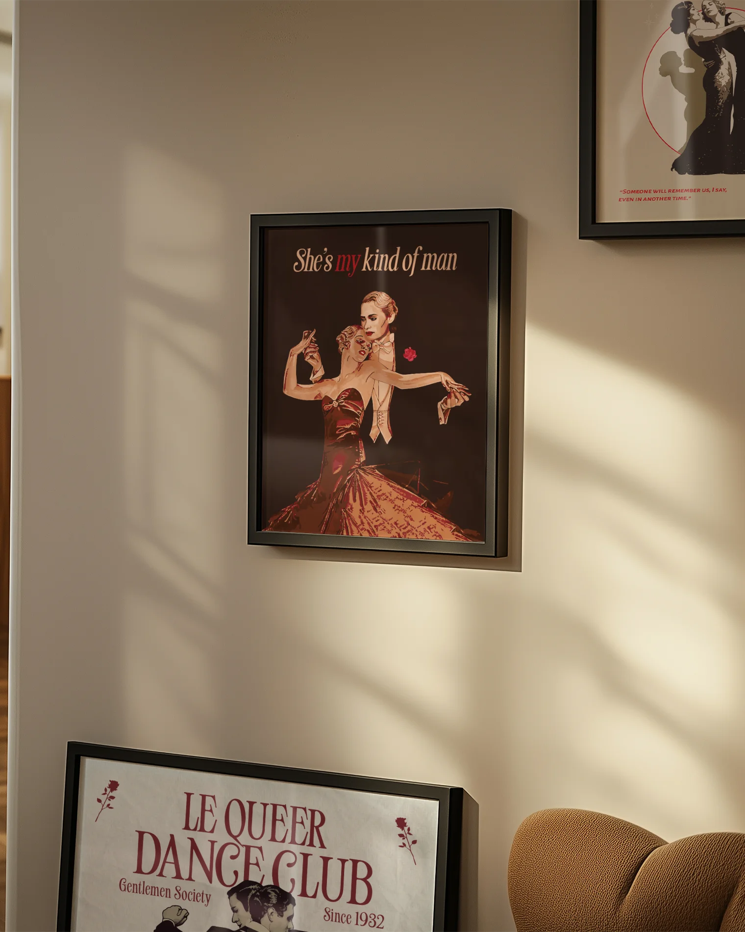 A framed print featuring a queer dancing couple in a vintage style, with the text: “She's my kind of man.”